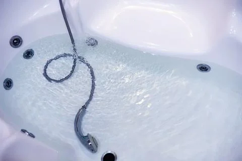 Soap bubbles background. Shampoo foam in the water in the bathroom. Jacuzzi.. Stock Photos