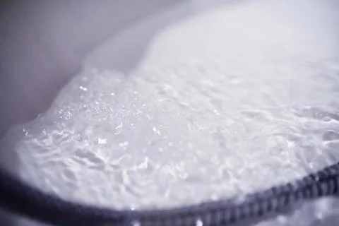 Soap bubbles background. Shampoo foam in the water in the bathroom. Jacuzzi.. Stock Photos