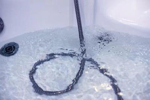 Soap bubbles background. Shampoo foam in the water in the bathroom. Jacuzzi.. Stock Photos