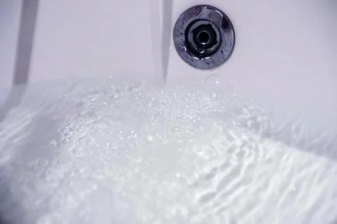 Soap bubbles background. Shampoo foam in the water in the bathroom. Jacuzzi.. Stock Photos