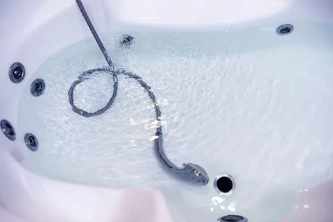 Soap bubbles background. Shampoo foam in the water in the bathroom. Jacuzzi.. Stock Photos