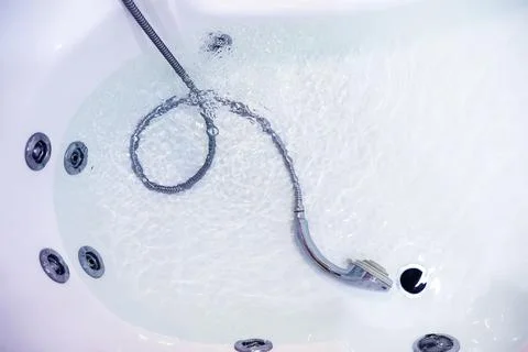 Soap bubbles background. Shampoo foam in the water in the bathroom. Jacuzzi.. Stock Photos