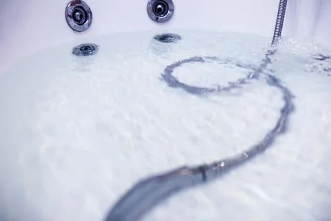 Soap bubbles background. Shampoo foam in the water in the bathroom. Jacuzzi.. Stock Photos