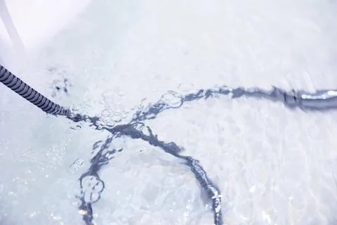 Soap bubbles background. Shampoo foam in the water in the bathroom. Jacuzzi.. Stock Photos