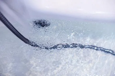 Soap bubbles background. Shampoo foam in the water in the bathroom. Jacuzzi.. Stock Photos