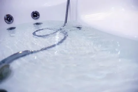 Soap bubbles background. Shampoo foam in the water in the bathroom. Jacuzzi.. Stock Photos