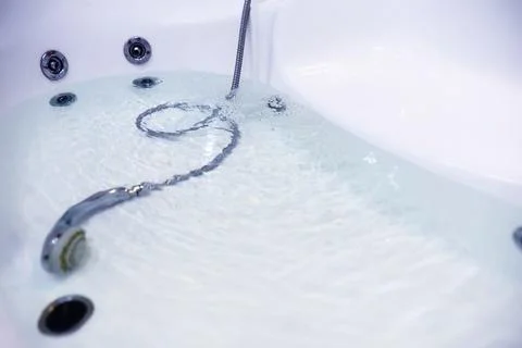 Soap bubbles background. Shampoo foam in the water in the bathroom. Jacuzzi.. Stock Photos