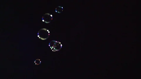 Soap bubbles on black background  4K Stock Footage 107534544