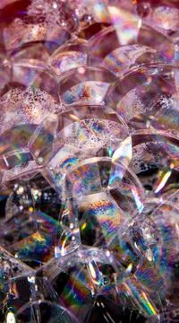 Soap bubbles on a black background, close-up, copy space, macro, pattern, tex Stock Photos