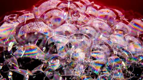 Soap bubbles on a black background, close-up, copy space, macro, pattern, tex Stock Photos