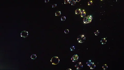 Soap bubbles on black background slow motion Stock Footage 107534600