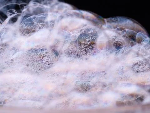 Soap bubbles close-up. Abstract pattern with soft focus. Macro shot of soap foam Stock Photos