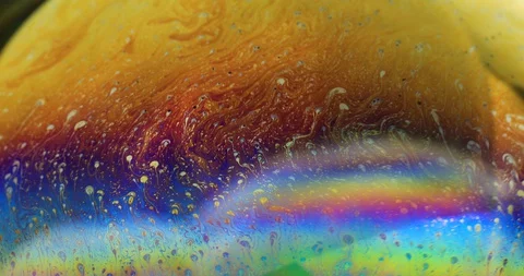 Soap bubbles closeup. Art abstract vibrant colorful background. Stock Footage 128492851