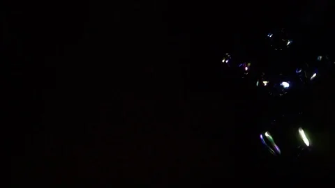 Soap Bubbles on dark background slow motion Stock Footage 76090678