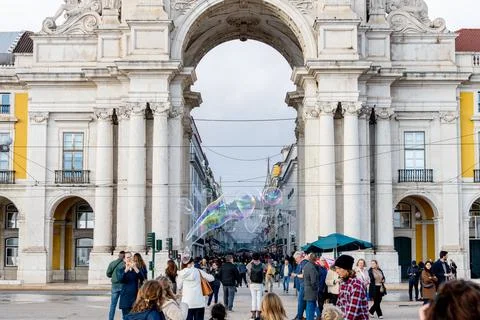 Soap bubbles drifting through Rua Augusta Arch Stock Photos