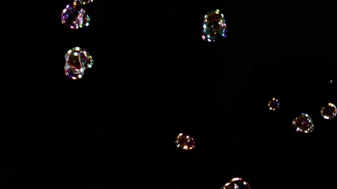 Soap Bubbles Falling Over Black Background 3 Stock Footage 163235502