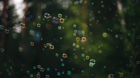 Soap bubbles float smoothly in front of the camera. Shooting in slow motion Stock Footage 327380651