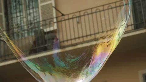 Soap bubbles floating in the air. close-up. slow motion. Radiant big soap bubble Stock Footage 252426393