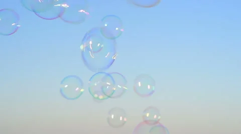Soap bubbles floating in the air as the summer sunsets Stock Footage 61253260