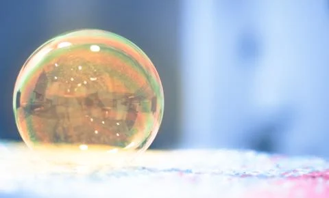 Soap bubbles floating in the air as the Summer sun sets Stock Photos