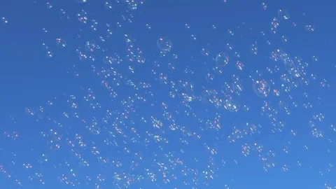 Soap bubbles floating in the blue sky Stock-Footage 128077121