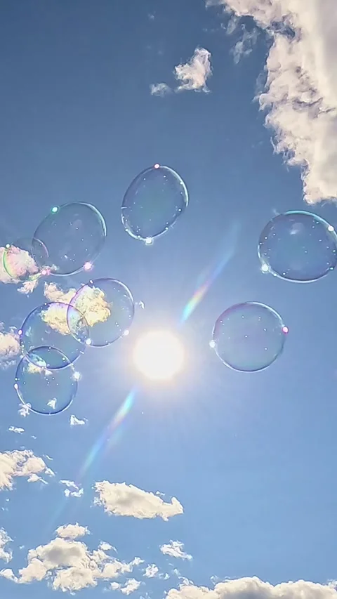Soap bubbles floating under bright summer sun Video stock 321930402