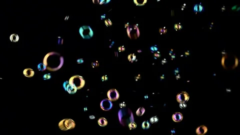 Soap bubbles fly and burst in the air. Black backgrounds 動画素材 96220959