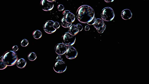 Soap Bubbles Fly Up and Burst on a Black Background 動画素材 135976097