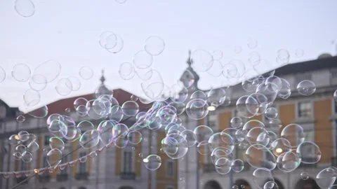 Soap bubbles fly around city. Street performer Fun performance Happy artist show Stock Footage 271223643