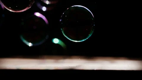Soap bubbles fly, burst and break with colorful holiday spray like a firework Stock Footage 117431325
