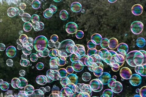 Soap bubbles on green background Stock Photos