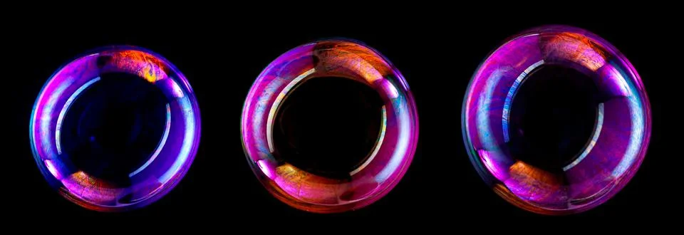Soap bubbles isolated on black background . Stock Photos
