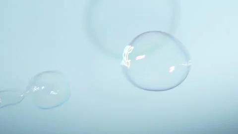 Soap Bubbles Isolated on Blue Background Stock Footage 259172433
