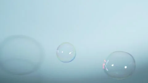 Soap Bubbles Isolated on Blue Background Stock Footage 259172434