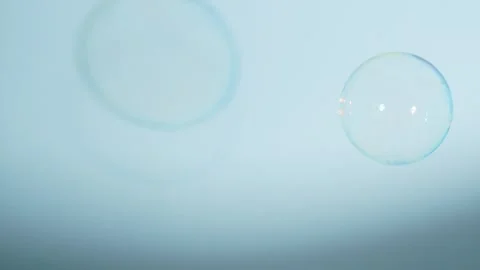 Soap Bubbles Isolated on Blue Background Stock Footage 259172439