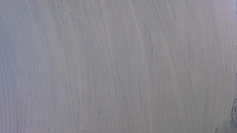 Soap bubbles melt on a white board Stock Footage 127638439