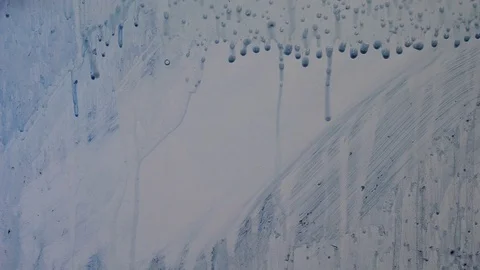 Soap bubbles melt on a white board Vídeos de archivo 127638599