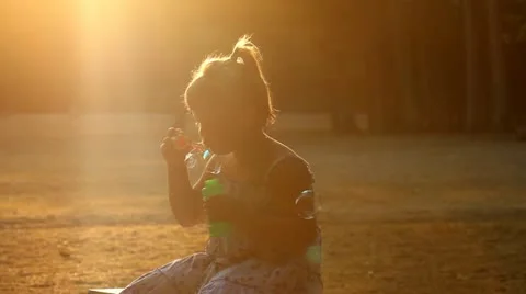 Soap bubbles in the park Stock Footage 12227765