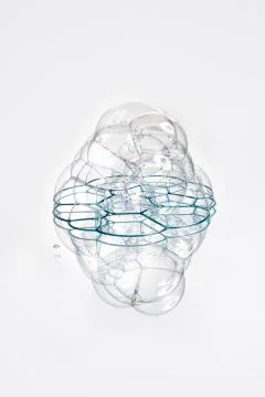 Soap bubbles with reflection on white background. Stock Photos