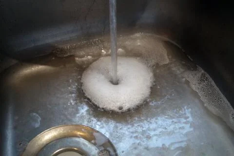 Soap bubbles in a sink Stock Photos
