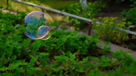 Soap bubbles into the sunset slow motion-1 Stock Footage 133207544
