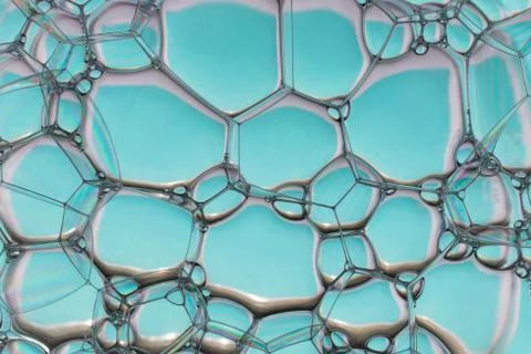 Soap bubbles on the water abstract background. Stock Photos
