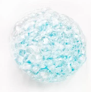 Soap bubbles on a white background from blue shower gel, top view. Stock Photos