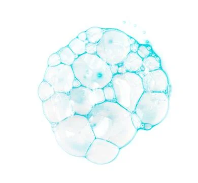 Soap bubbles on a white background from blue shower gel, top view. Stock Photos