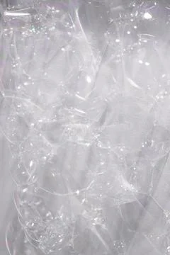 Soap bubbles on white wall close-up for background or texture overlay Stock Photos