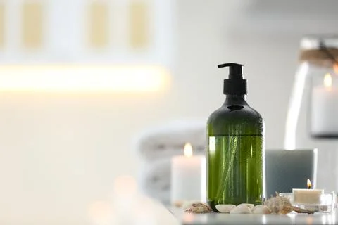 Soap dispenser and decor elements on table. Space for text Stock Photos