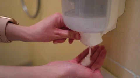 Soap Dispenser, Girl in the Hospital Draws Soap from Dispenser, Hand Washing Stock Footage