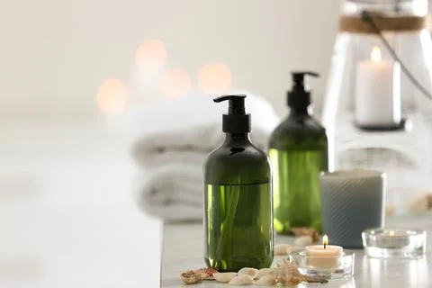 Soap dispensers and decor elements on table. Space for text Stock Photos