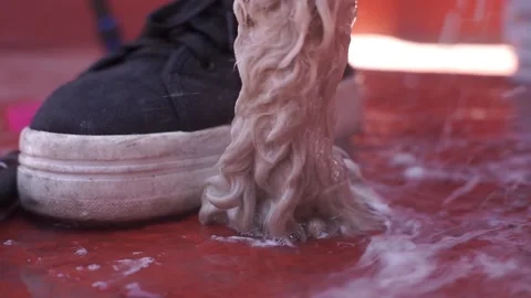 Soap falling between a dog paw and a tennis Stock Footage 136615451