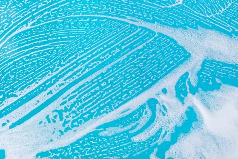 Soap foam on a blue background Stock Photos